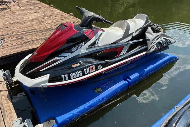 Slide: The Image of 2018 Yamaha WaveRunner VX Limited on dock, red and black design. - 1