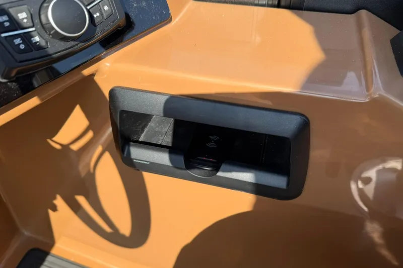 Slide: The Image of Control panel of 2025 Bentley Pontoons Elite 223 Swingback with wireless charging dock. - 12