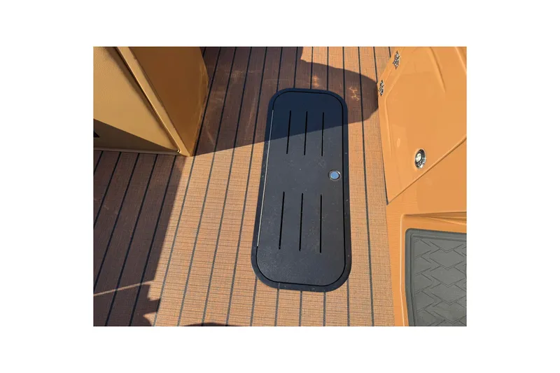 Slide: The Image of 2025 Bentley Pontoons Elite 223 Swingback deck with sleek black hatch cover. - 7