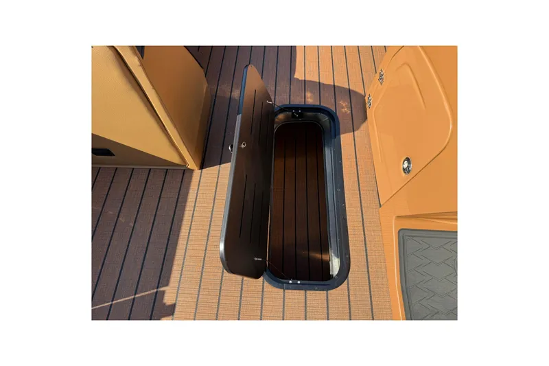 Slide: The Image of 2025 Bentley Pontoons Elite 223 Swingback deck with open storage compartment. - 8