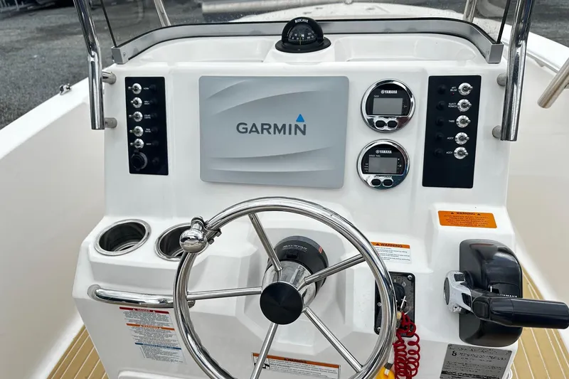 Slide: The Image of 2017 Robalo R180 Center Console dashboard with Garmin navigation and Yamaha controls. - 4