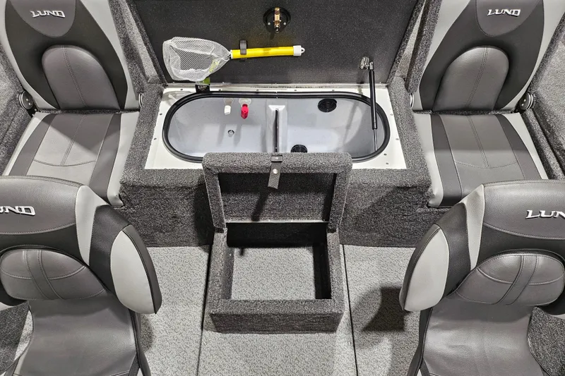 Slide: The Image of 2026 Lund 1875 Renegade boat interior with seating and storage compartments. - 11