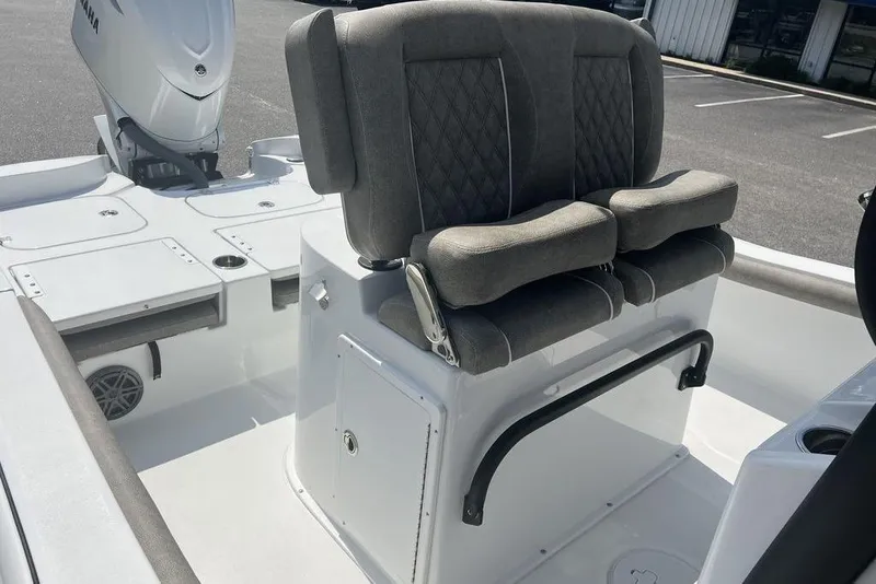Slide: The Image of 2026 Sea Hunt BX 25 FS boat interior with cushioned seating and Yamaha engine. - 12