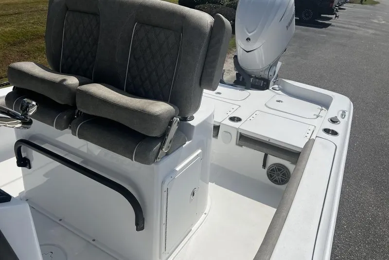Slide: The Image of 2026 Sea Hunt BX 25 FS boat interior with dual seats and outboard motor. - 15