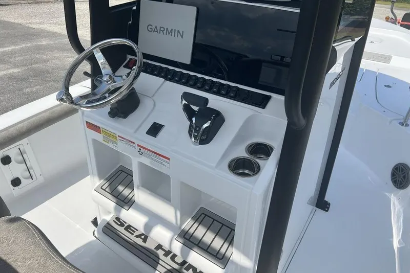 Slide: The Image of 2026 Sea Hunt BX 25 FS boat console with Garmin navigation system and dual cup holders. - 16