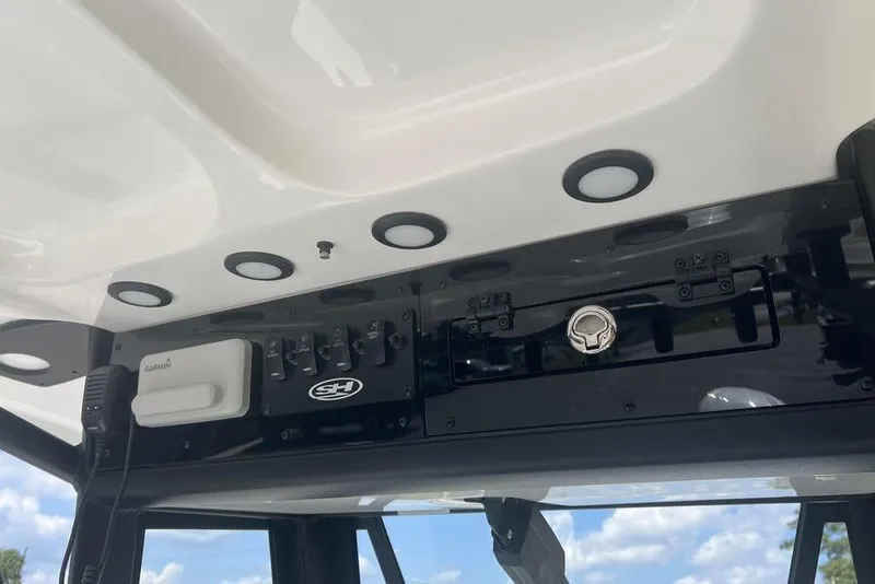 Slide: The Image of 2026 Sea Hunt BX 25 FS boat console with Garmin device and control panel. - 17