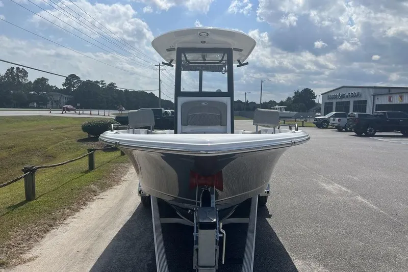 Slide: The Image of 2026 Sea Hunt BX 25 FS boat on trailer in outdoor showroom. - 6