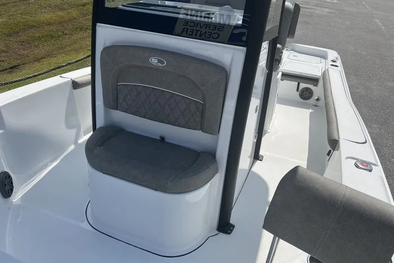 Slide: The Image of 2026 Sea Hunt BX 25 FS boat interior with cushioned seating and console. - 9