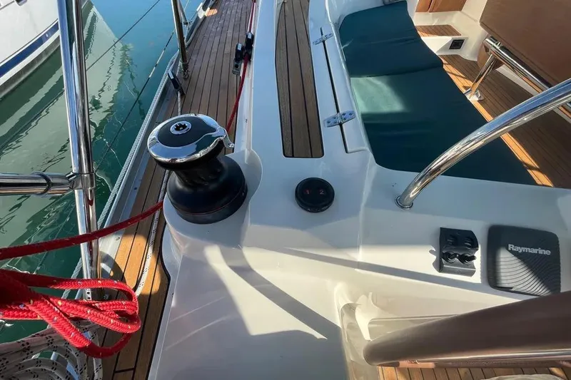 Slide: The Image of 2012 Delphia 47 yacht deck with winch, ropes, and Raymarine equipment. - 11