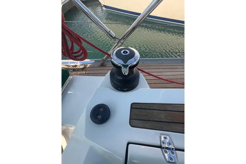 Slide: The Image of Delphia 47 sailboat deck with winch and red rope, 2012 model. - 12