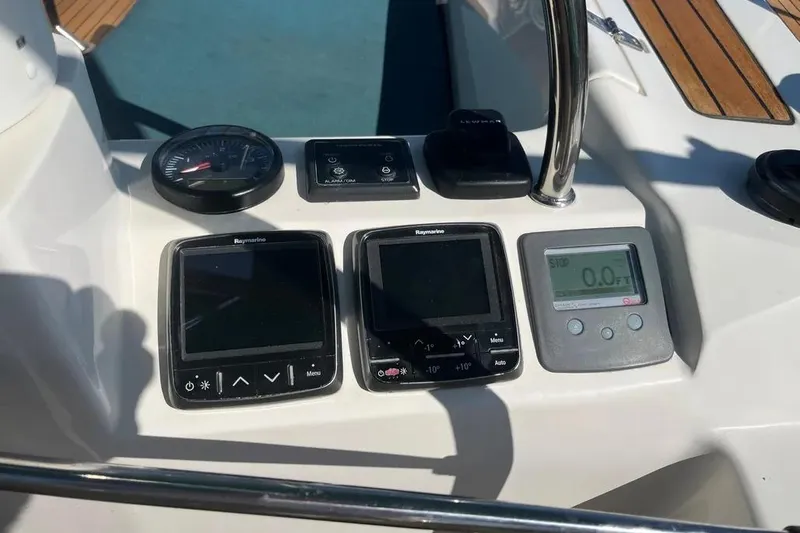 Slide: The Image of Control panel of a 2012 Delphia 47 yacht with navigation instruments. - 16