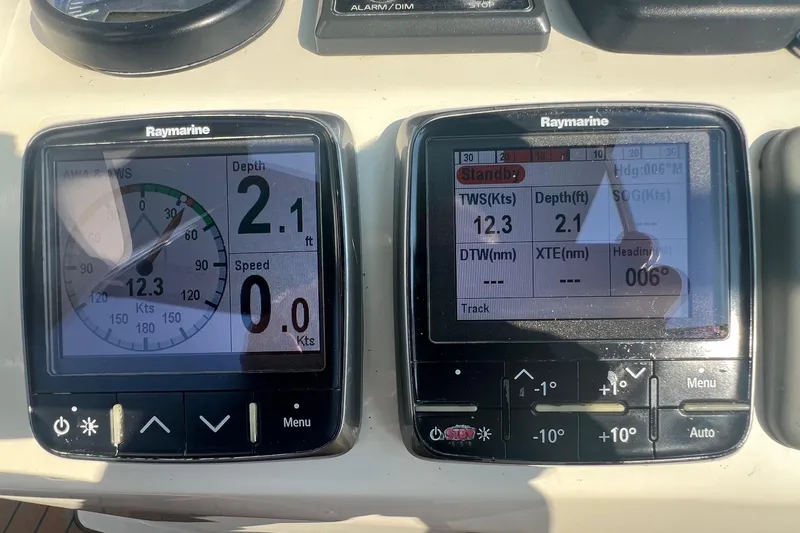 Slide: The Image of Raymarine navigation displays on a 2012 Delphia 47, showing depth and speed data. - 19
