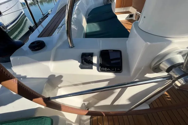 Slide: The Image of Cockpit of 2012 Delphia 47 yacht with navigation controls and seating. - 20