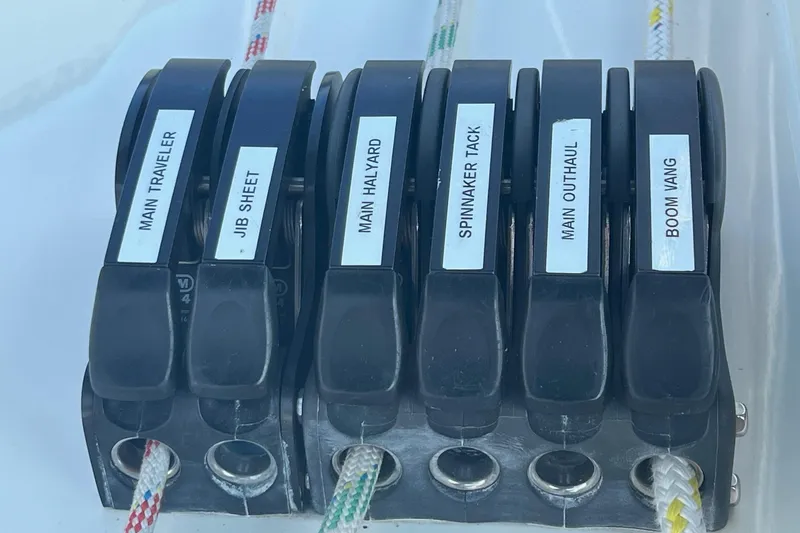 Slide: The Image of Sailing control panel on a 2012 Delphia 47 yacht with labeled rope clutches. - 23