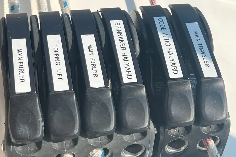 Slide: The Image of Sailing controls on a 2012 Delphia 47 yacht, labeled for various halyards and furlers. - 24