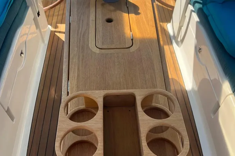 Slide: The Image of Wooden deck of 2012 Delphia 47 yacht with cup holders and seating. - 26