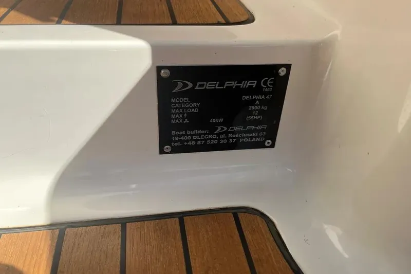 Slide: The Image of Plaque on Delphia 47 sailboat, 2012 model, displaying specifications and builder details. - 29