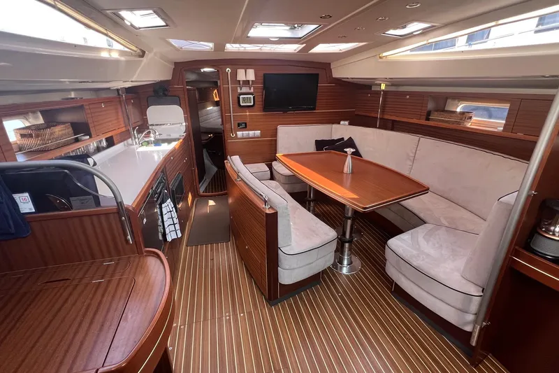 Slide: The Image of Luxurious interior of 2012 Delphia 47 yacht with elegant wood finishes and spacious seating. - 31