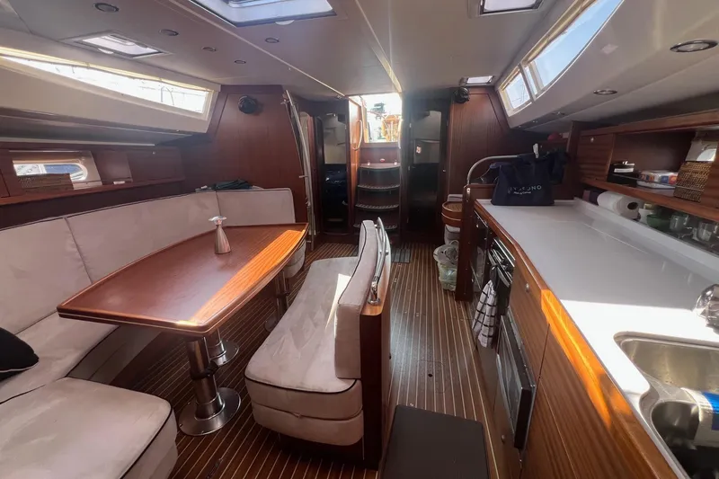 Slide: The Image of Interior of 2012 Delphia 47 yacht with elegant wood finish and modern amenities. - 32