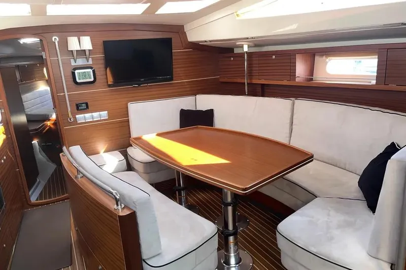 Slide: The Image of Luxurious interior of 2012 Delphia 47 yacht with elegant wood finish and cozy seating. - 34