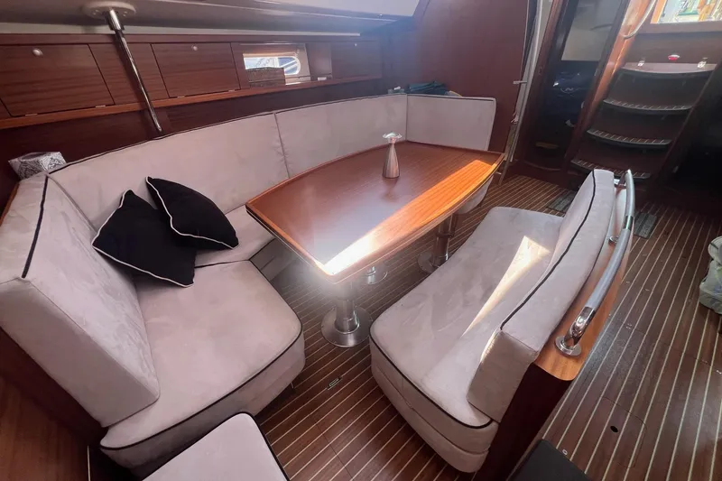 Slide: The Image of Interior of 2012 Delphia 47 yacht with elegant seating and wooden table. - 35