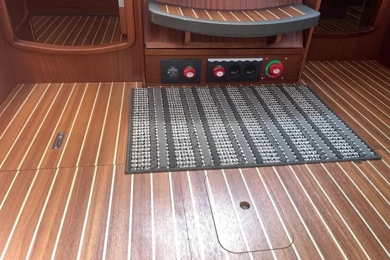 Slide: The Image of Interior of 2012 Delphia 47 yacht with wood flooring and control panel. - 55