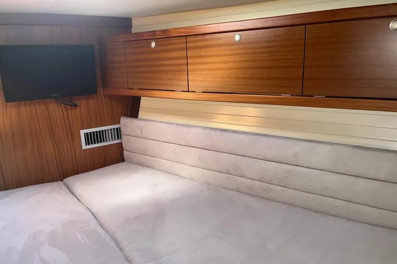 Slide: The Image of Cozy interior of 2012 Delphia 47 yacht with TV and wooden cabinets. - 65