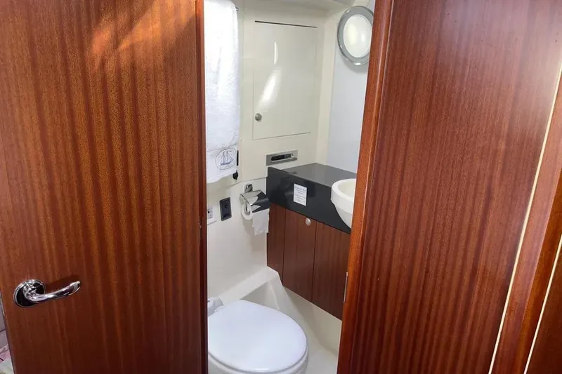 Slide: The Image of Luxurious bathroom interior of 2012 Delphia 47 yacht with wooden finish and modern amenities. - 66