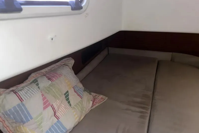 Slide: The Image of Cozy cabin interior of 2012 Delphia 47 yacht with colorful pillow. - 69