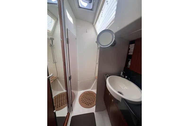 Slide: The Image of Luxurious bathroom in 2012 Delphia 47 yacht with shower and sink. - 80