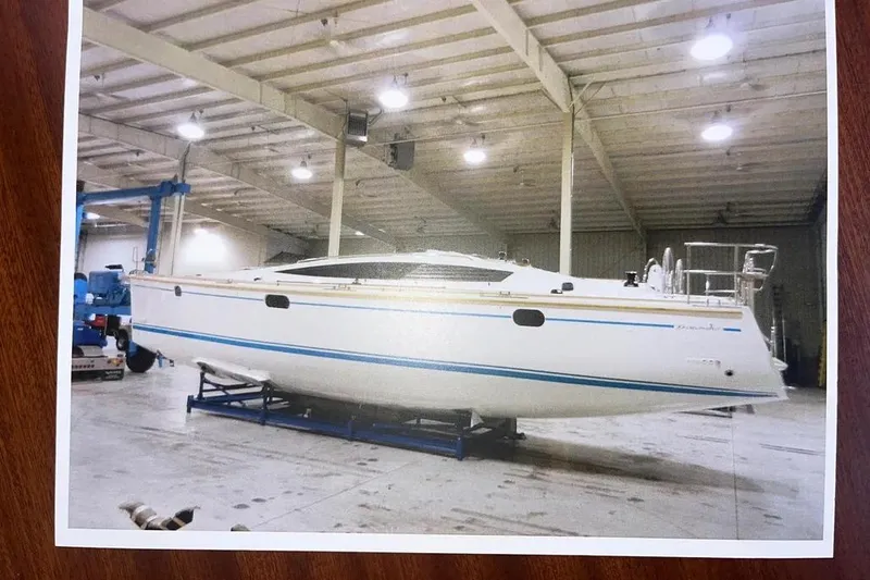 Slide: The Image of Delphia 47 yacht from 2012 in a spacious indoor facility. - 89