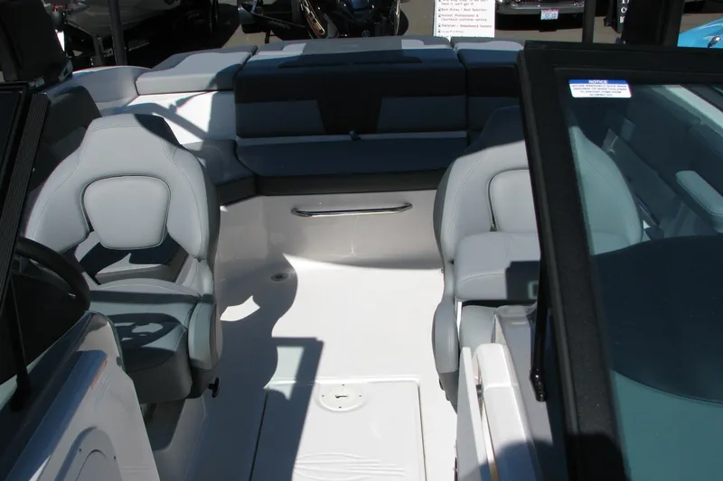 Slide: The Image of 2026 Chaparral 23 SSi OB boat interior with gray seating and modern design. - 5