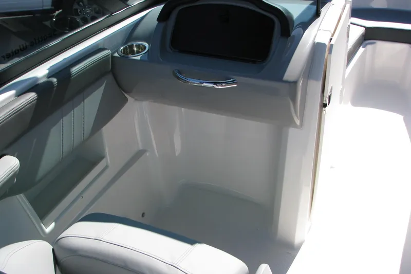 Slide: The Image of 2026 Chaparral 23 SSi OB boat interior with sleek seating and storage compartment. - 6