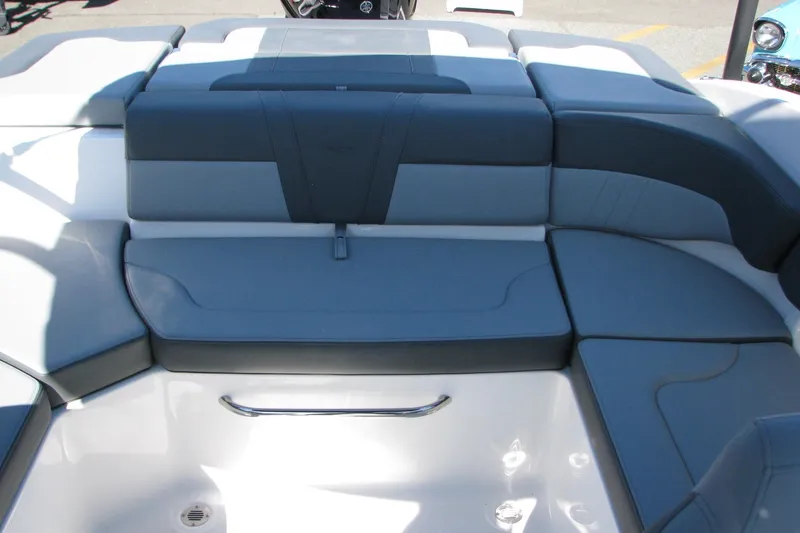 Slide: The Image of 2026 Chaparral 23 SSi OB boat interior with cushioned seating and sleek design. - 9