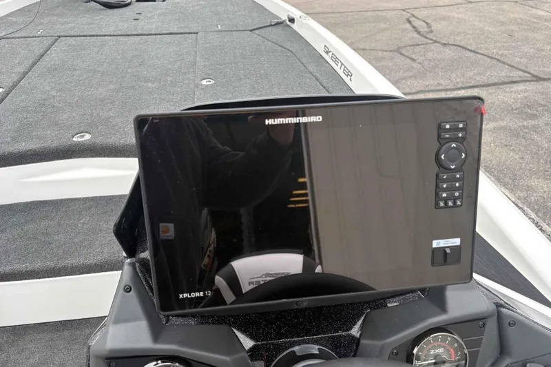 Slide: The Image of 2026 Skeeter ZXE21 boat with Humminbird Xplore 12 display on dashboard. - 6