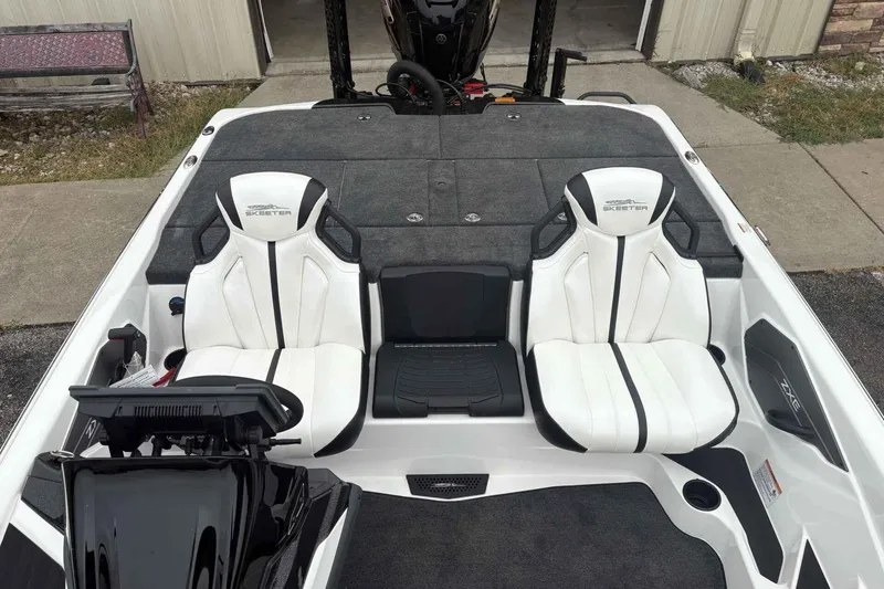 Slide: The Image of 2026 Skeeter ZXE21 boat interior with white seats and modern dashboard. - 9