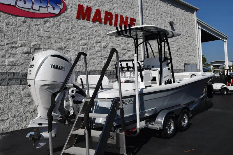 Slide: The Image of 2026 BlackJack 256 Coastal boat with Yamaha engine at marine dealership. - 4