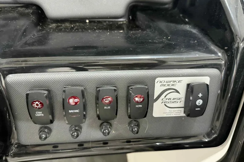 Slide: The Image of Control panel of 2022 Yamaha SX190 boat with various switches and cruise assist feature. - 18