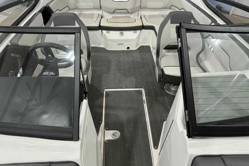 Slide: The Image of 2022 Yamaha Boats SX190 interior with seating and steering wheel, showcasing modern design. - 23