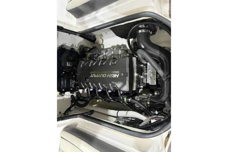 Slide: The Image of 2022 Yamaha Boats SX190 engine compartment showcasing high output engine components. - 24