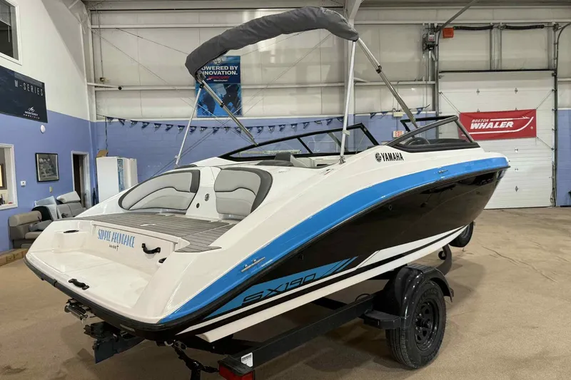 Slide: The Image of 2022 Yamaha Boats SX190 in showroom, featuring sleek design and modern features. - 3