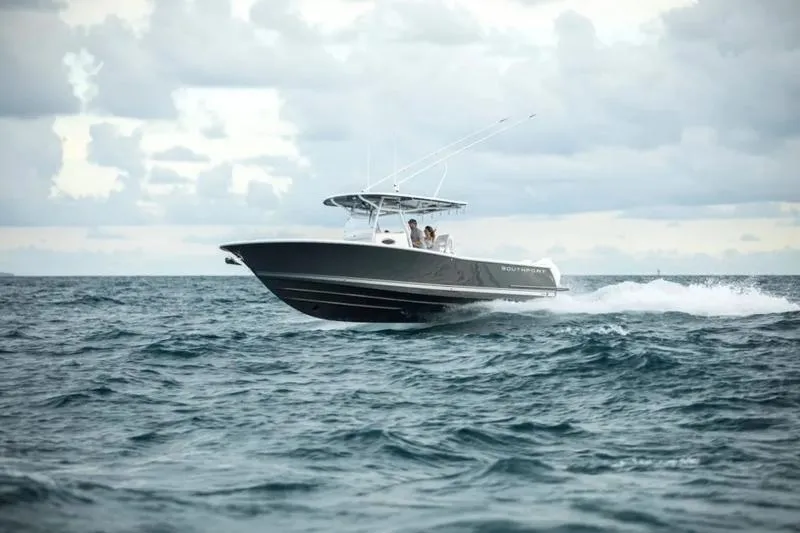 The Image of 2026 Southport 30 FE boat cruising on open water under cloudy skies. - 0