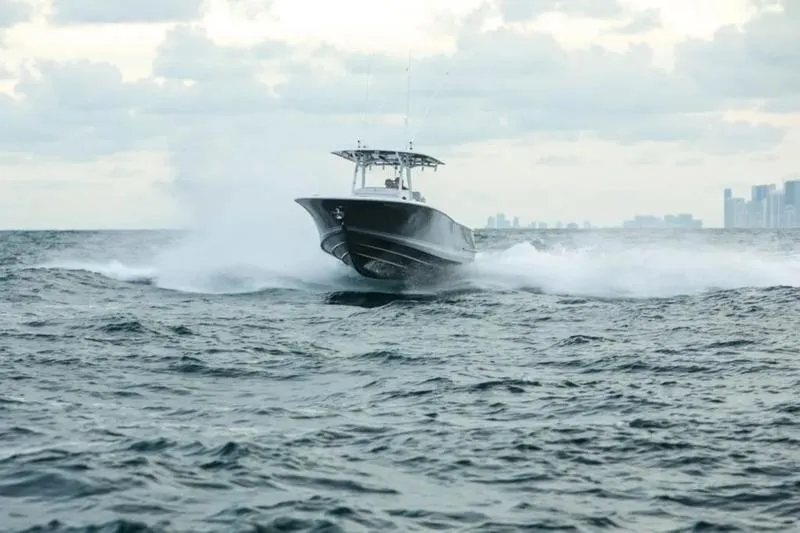 Slide: The Image of 2026 Southport 30 FE boat cruising on choppy ocean waters. - 1
