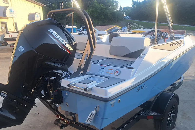 Slide: The Image of 2026 Starcraft SV 16 OB boat with Mercury outboard motor, displayed outdoors. - 1