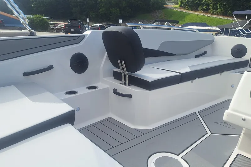 Slide: The Image of 2026 Starcraft SV 16 OB boat interior with seating and cup holders. - 10