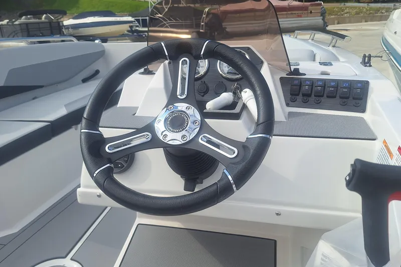 Slide: The Image of Steering wheel and dashboard of 2026 Starcraft SV 16 OB boat. - 8