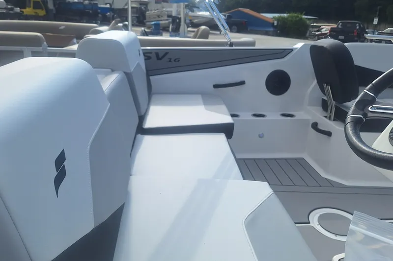 Slide: The Image of 2026 Starcraft SV 16 OB boat interior with white seating and modern design. - 9