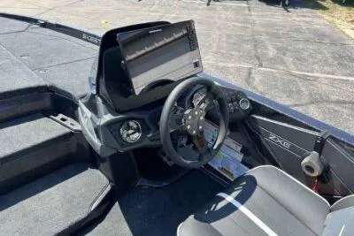 Slide: The Image of 2026 Skeeter ZXE20 boat cockpit with steering wheel and control panel. - 10