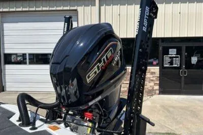 Slide: The Image of 2026 Skeeter ZXE20 boat engine with SHD branding, parked outside a garage. - 4