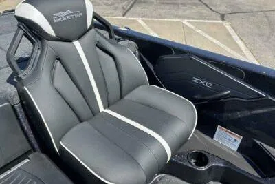 Slide: The Image of 2026 Skeeter ZXE20 boat seat with sleek black and white design. - 7